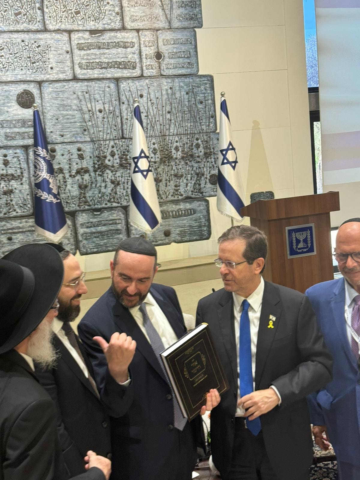 Rabbi Pini Dunner presenting his book to President Isaac Herzog at Beit HaNassi, the President's Residence in Jerusalem