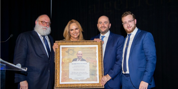 Receiving an award from The Algemeiner